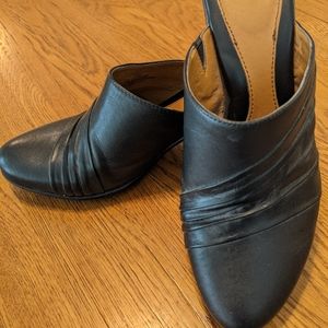 Black leather upper slip on heal. Size 7.5